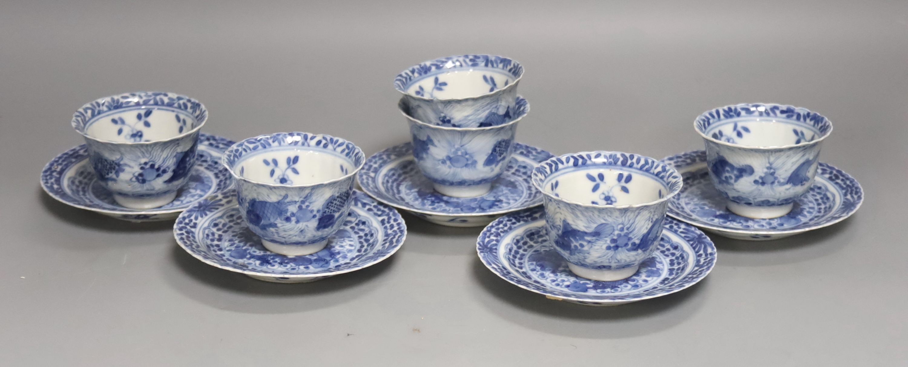 Five 19th century Chinese blue and white tea bowls and saucers, four-character marks to bases